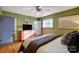 Well-lit bedroom with a coral dresser and en-suite bathroom at 9638 Pleasant View Ln, Mint Hill, NC 28227