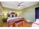 Bright bedroom featuring a comfortable bed and wood floors at 9638 Pleasant View Ln, Mint Hill, NC 28227