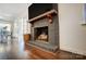 Brick fireplace with wood mantel and hearth in living room at 9638 Pleasant View Ln, Mint Hill, NC 28227