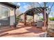 Brick patio with covered pergola and comfortable seating area at 9638 Pleasant View Ln, Mint Hill, NC 28227