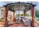 Relaxing pergola with string lights and seating for outdoor entertaining at 9638 Pleasant View Ln, Mint Hill, NC 28227