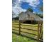 Beautiful backyard view of a home with a deck, fenced yard, and lush green grass at 17 N Arlington St, Salisbury, NC 28144