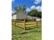 Lovely backyard featuring a wooden fence, lush greenery, and a raised deck off the back of the house at 17 N Arlington St, Salisbury, NC 28144