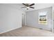 Bright bedroom with neutral carpeting and a view of the backyard at 17 N Arlington St, Salisbury, NC 28144