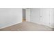 Spacious bedroom with neutral carpeting and access to hallway at 17 N Arlington St, Salisbury, NC 28144