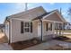 Newly built tan house with a front porch and landscaping at 17 N Arlington St, Salisbury, NC 28144