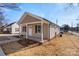 Tan house with white trim and a covered porch at 17 N Arlington St, Salisbury, NC 28144