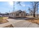 Newly built tan house with a front porch and driveway at 17 N Arlington St, Salisbury, NC 28144
