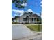 Inviting one-story home with a cozy front porch, manicured lawn, and a spacious driveway at 17 N Arlington St, Salisbury, NC 28144