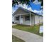 Charming one-story home with tan siding, black shutters, covered porch, and well-maintained lawn at 17 N Arlington St, Salisbury, NC 28144