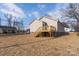 Tan house with wooden deck and steps at 17 N Arlington St, Salisbury, NC 28144