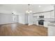 White kitchen with granite countertops and appliances at 17 N Arlington St, Salisbury, NC 28144