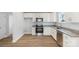 Modern kitchen with white cabinets and granite countertops at 17 N Arlington St, Salisbury, NC 28144