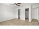 Bright bedroom with hardwood floors and an ensuite bathroom at 2712 New Hamlin Way, Charlotte, NC 28210