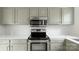 Well-lit kitchen featuring stainless steel appliances and shaker style cabinets at 2712 New Hamlin Way, Charlotte, NC 28210