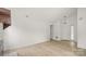 Bright living room featuring hardwood floors, a fireplace, and ample space at 2712 New Hamlin Way, Charlotte, NC 28210