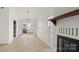 Spacious living room with luxury flooring, brick fireplace, contemporary lighting and sliding doors to the backyard at 2712 New Hamlin Way, Charlotte, NC 28210