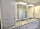 Double vanity bathroom with marble countertop and large mirror at 496 19Th Avenue Nw Cir, Hickory, NC 28601