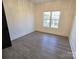 Well-lit bedroom with hardwood floors and a large window at 496 19Th Ave Nw Cir, Hickory, NC 28601