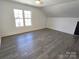 Bright bedroom with wood floors and large window at 496 19Th Avenue Nw Cir, Hickory, NC 28601