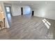 Spacious bonus room with hardwood floors and access to other rooms at 496 19Th Avenue Nw Cir, Hickory, NC 28601
