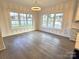 Bright breakfast nook with hardwood floors and built-in window seats at 496 19Th Avenue Nw Cir, Hickory, NC 28601