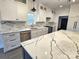 White kitchen cabinets, marble countertops, stainless steel appliances at 496 19Th Avenue Nw Cir, Hickory, NC 28601