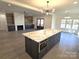 Modern kitchen island with quartz countertop and built-in oven at 496 19Th Avenue Nw Cir, Hickory, NC 28601