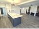 Modern kitchen island with quartz countertop and built-in oven at 496 19Th Avenue Nw Cir, Hickory, NC 28601