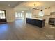 Open concept kitchen and living area with large island and fireplace at 496 19Th Avenue Nw Cir, Hickory, NC 28601