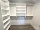 Bright walk-in closet with shelves and hanging rods at 496 19Th Avenue Nw Cir, Hickory, NC 28601