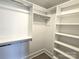 Large walk-in closet with shelves and hanging rods at 496 19Th Avenue Nw Cir, Hickory, NC 28601