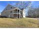 Two-story home with deck, stairs, and attached garage at 496 19Th Avenue Nw Cir, Hickory, NC 28601