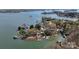 Panoramic aerial view of lakefront property featuring a private dock and serene waters at 5056 Bridge Way, Denver, NC 28037