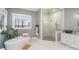 Spa-like bathroom featuring a large soaking tub and a walk-in shower at 5056 Bridge Way, Denver, NC 28037