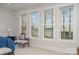 Bedroom with lake view and comfortable seating area at 5056 Bridge Way, Denver, NC 28037
