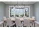 Dining room with a large wooden table and stunning lake views at 5056 Bridge Way, Denver, NC 28037