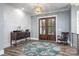 Bright and airy entryway with hardwood floors and a unique rug at 5056 Bridge Way, Denver, NC 28037