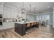 Modern kitchen with a large island and stainless steel appliances at 5056 Bridge Way, Denver, NC 28037