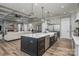 Open concept kitchen with a large island and a view of the living area at 5056 Bridge Way, Denver, NC 28037