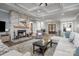 Open living room showcasing a cozy fireplace and hardwood floors at 5056 Bridge Way, Denver, NC 28037