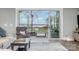 Living area with sliding doors opening to a deck and lake view at 5056 Bridge Way, Denver, NC 28037