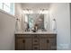 Elegant bathroom with double vanity, stylish fixtures, and decorative accents at 5680 Clear Creek Ln, Charlotte, NC 28215