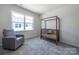 Bright Bedroom with a crib, comfortable chair, and ample natural light from the large window at 5680 Clear Creek Ln, Charlotte, NC 28215
