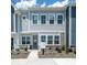 Charming two-story home showcasing a gray exterior, well-manicured landscaping, and a welcoming front porch at 5680 Clear Creek Ln, Charlotte, NC 28215