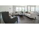 Spacious living room features comfortable seating, stylish furnishings, and large windows for natural light at 5680 Clear Creek Ln, Charlotte, NC 28215
