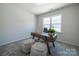 Bright home office with modern desk and large window providing natural light at 5680 Clear Creek Ln, Charlotte, NC 28215