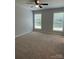 Bright bedroom with two large windows, neutral carpet, ceiling fan and natural light at 702 Park Ave, Salisbury, NC 28144