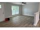 Bright living room with wood floors, a ceiling fan, and fresh paint at 702 Park Ave, Salisbury, NC 28144