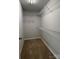 Walk-in closet featuring shelving and neutral carpet at 702 Park Ave, Salisbury, NC 28144